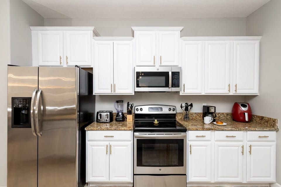 The open, airy kitchen offers ample space & all the comforts of home