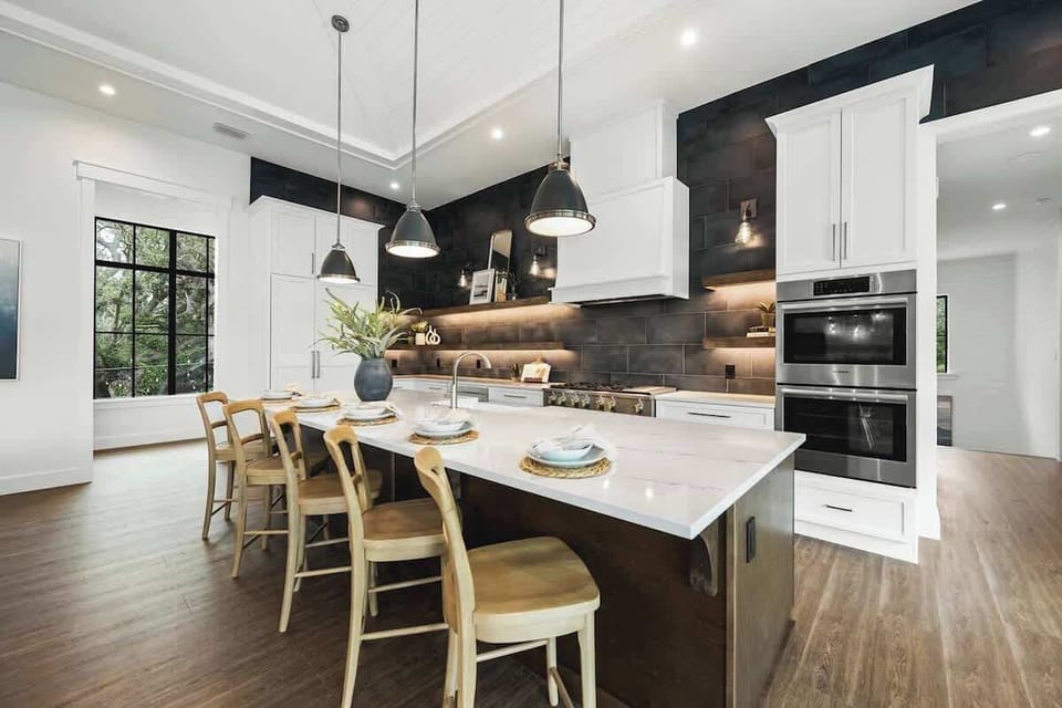 House A - Great Room - Open Floor Plan - Fully Stocked Kitchen, Dining for 10 and Bar seating for 5 - Balcony Access - Lake Views