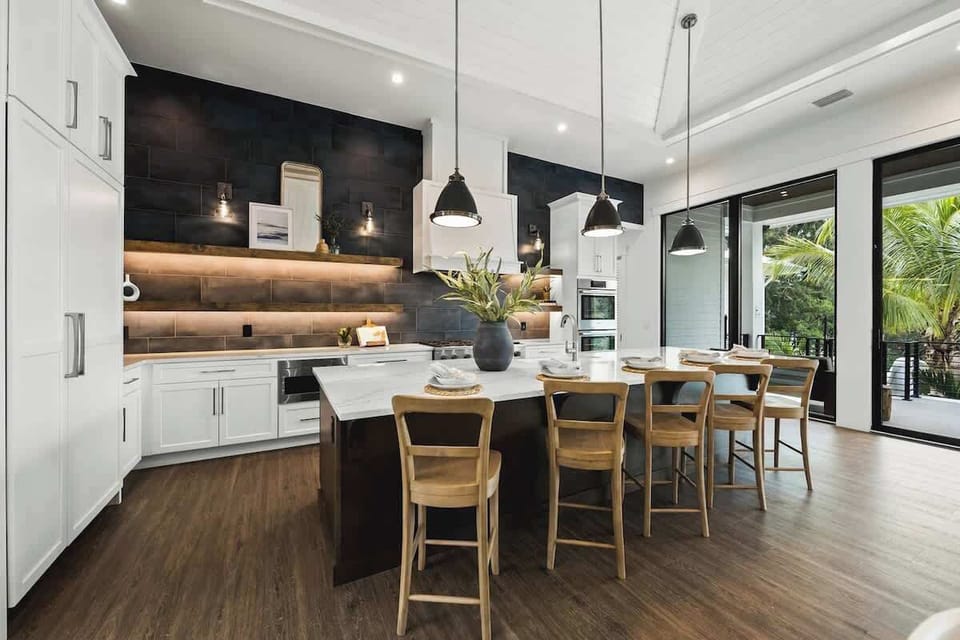 House A - Great Room - Open Floor Plan - Fully Stocked Kitchen, Dining for 10 and Bar seating for 5 - Balcony Access - Lake Views
