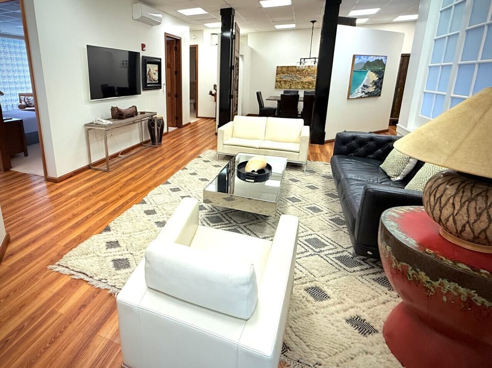 Expansive Living Room With Doors Leading to Dining Area