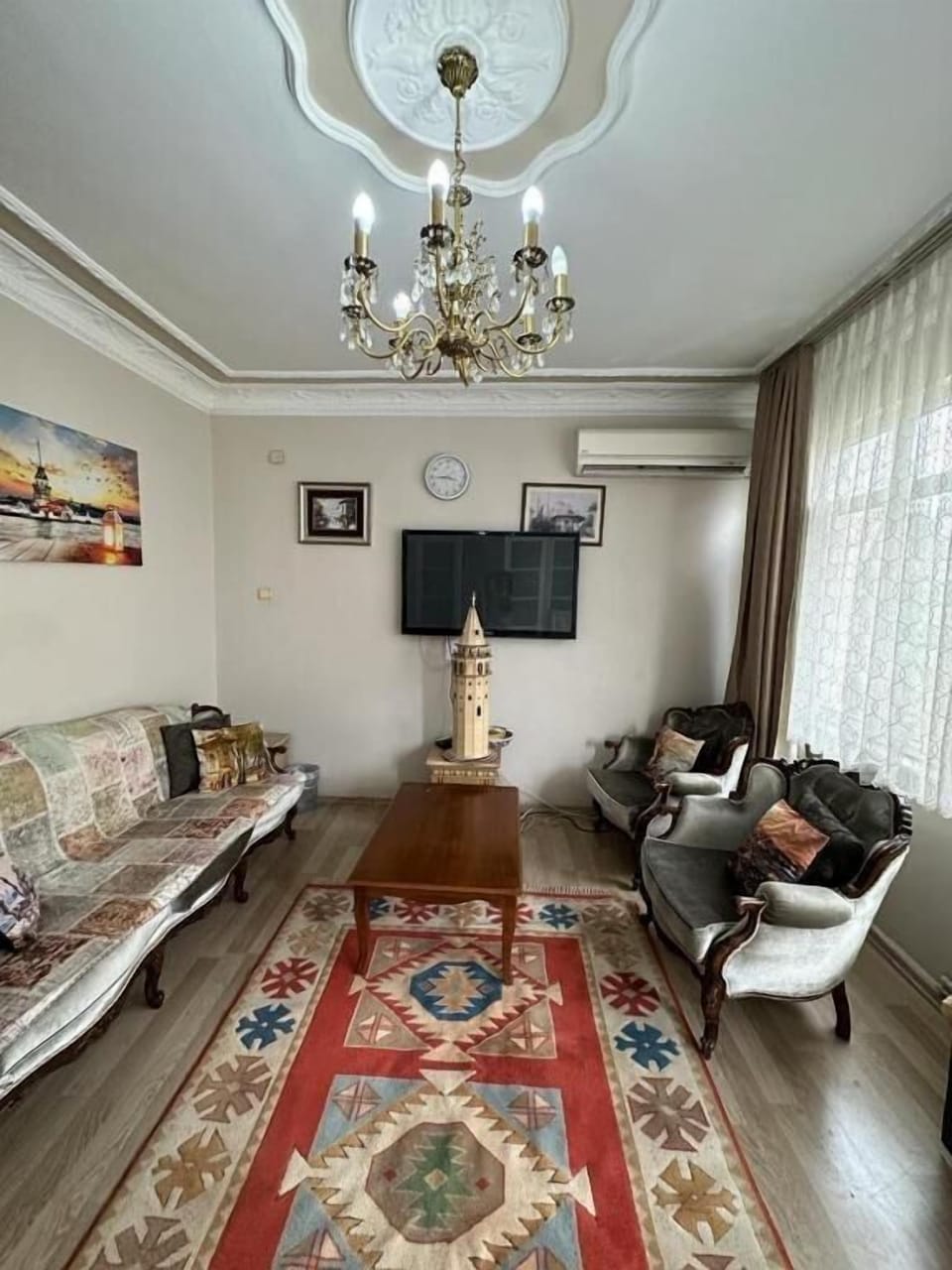 Classic Apartment, Balcony, City View | Living area | 30-inch flat-screen TV with satellite channels