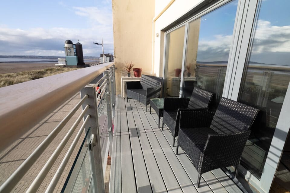 Balcony with seating overlooking Swansea Bay