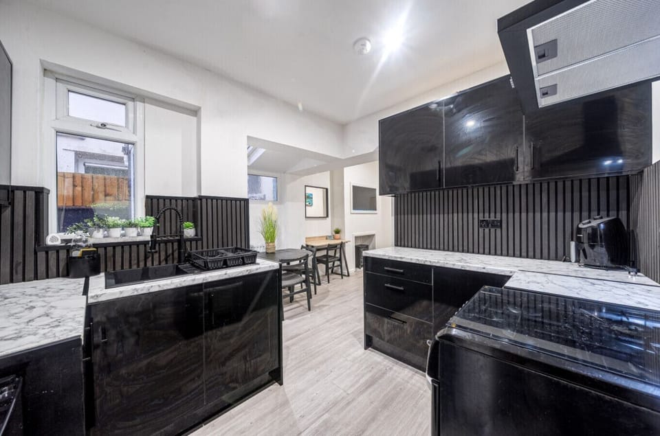 Contemporary kitchen with full-size oven and hob