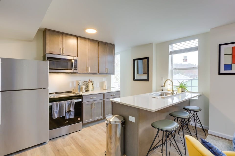 Modern kitchen design effects, gold tone fixtures, soft close cabinets & drawers