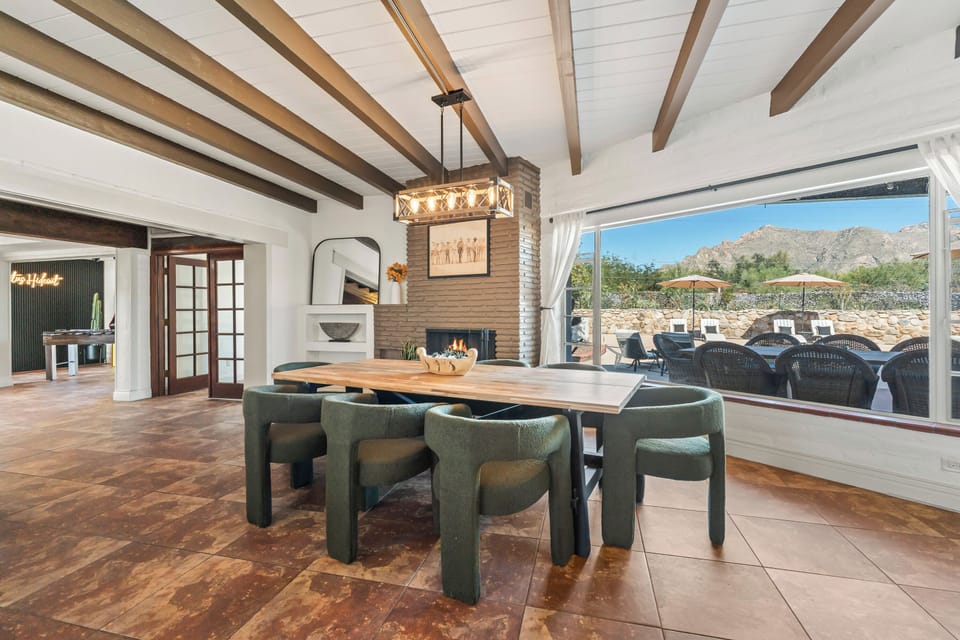 The stunning dining room has a one-of-a-king wooden table that seats eight.