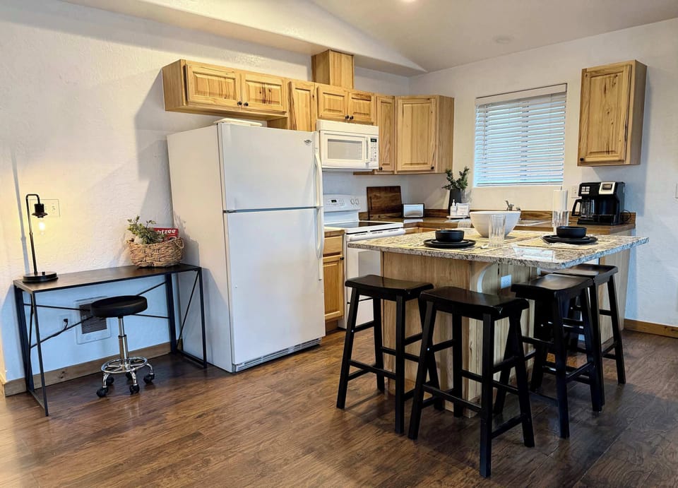 Full kitchen and ammenities with small desk