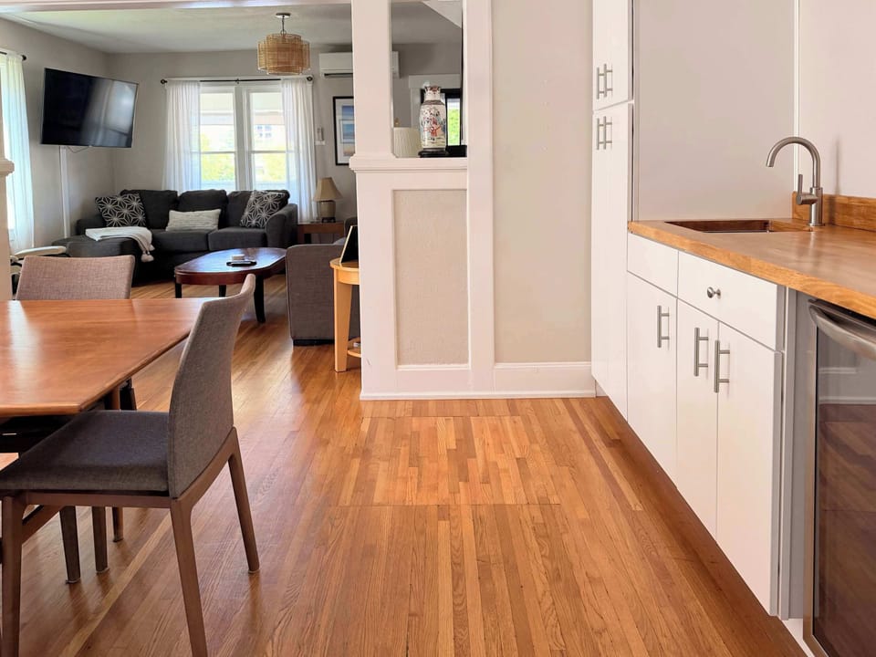 Enjoy the convenience of the buffet adjacent to the dining room, including an ice maker, coffee pot and beverage refrigerator. 