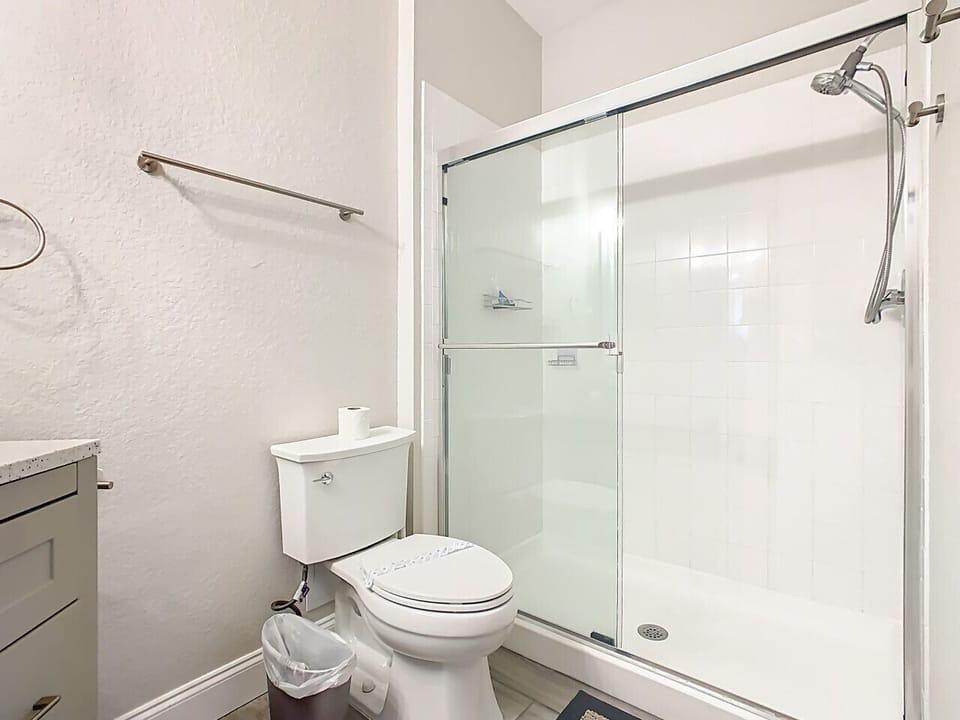 Clean and modern full bathroom with a shower-tub combo and updated fixtures.
