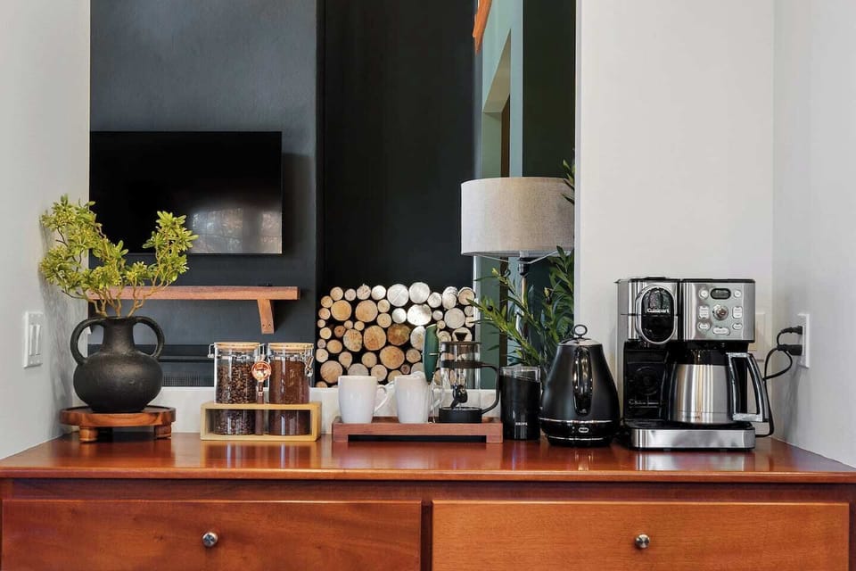 Fully stocked coffee bar with drip coffee, k-cups, teas and hot chocolate, sweeteners and cream 