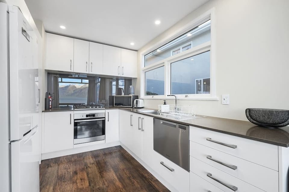 Our modern kitchen features all the appliances and cooking utensils you would expect.