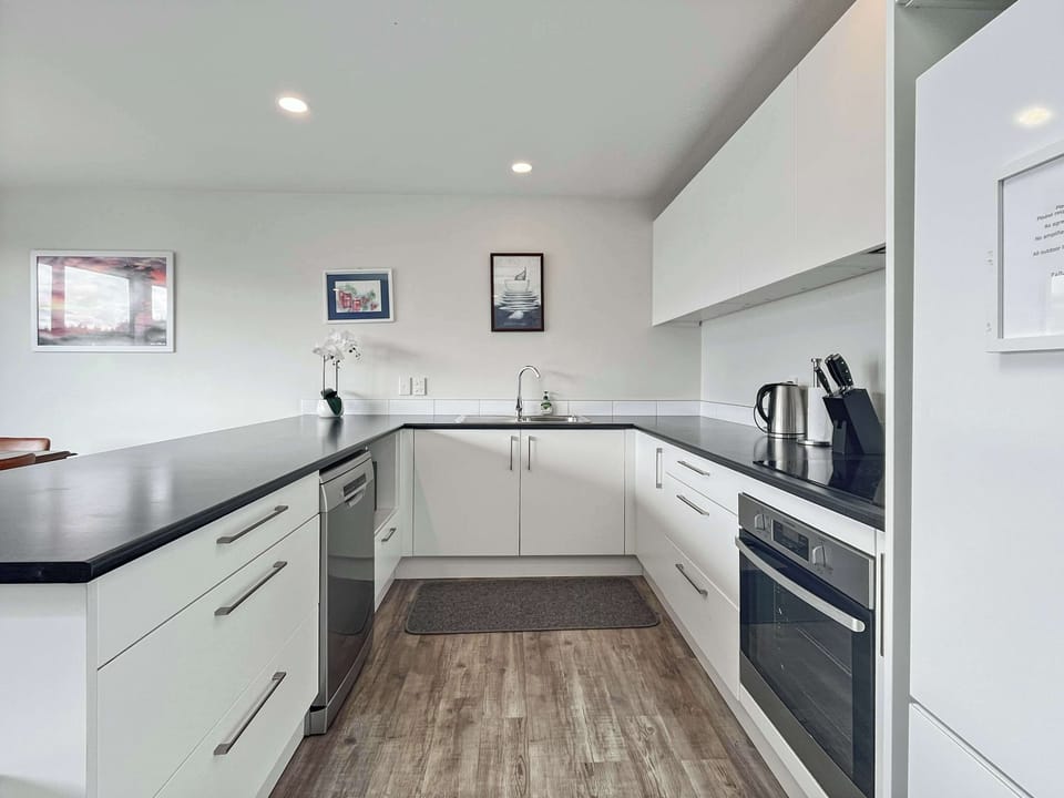 Fully equipped kitchen with modern appliances and plenty of bench space