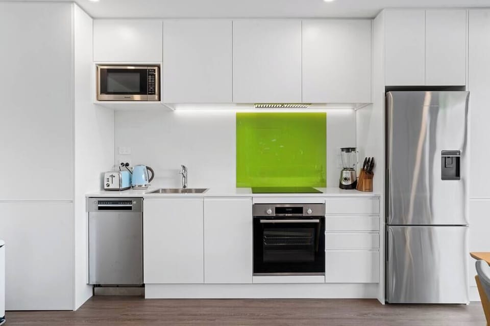 Fully equipped kitchen, with all the appliances you'd expect...

Dishwasher, induction cook top, oven, microwave, rice cooker, kettle, toaster, blender, fridge with filtered water dispenser, and much more!