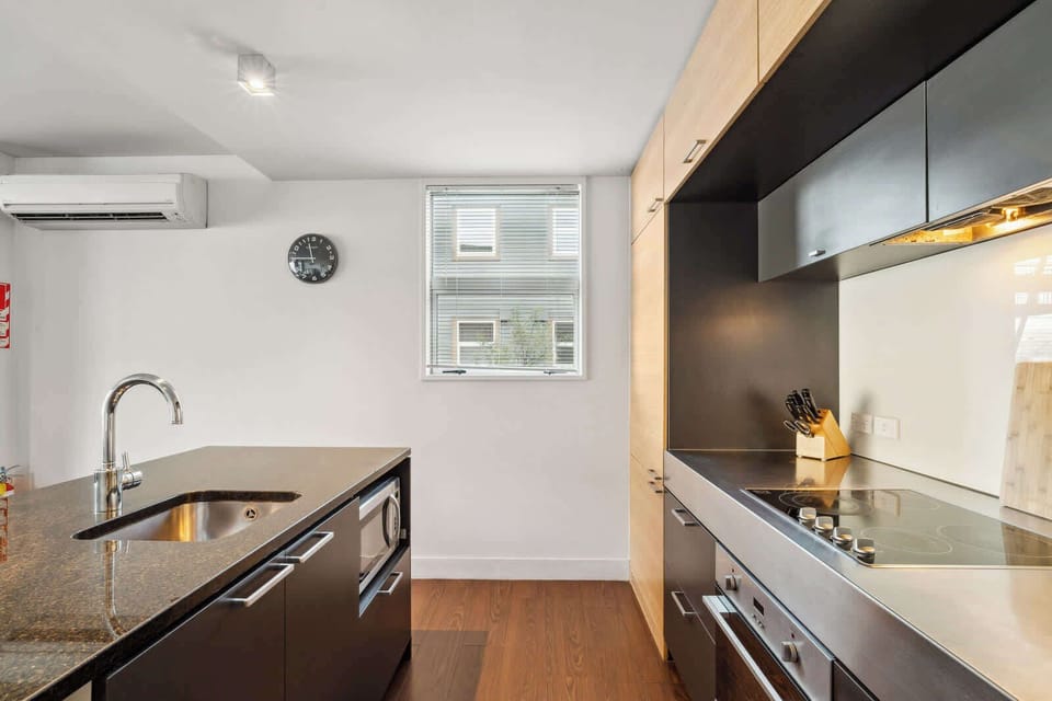 Fully equipped kitchen featuring stainless steel appliances.