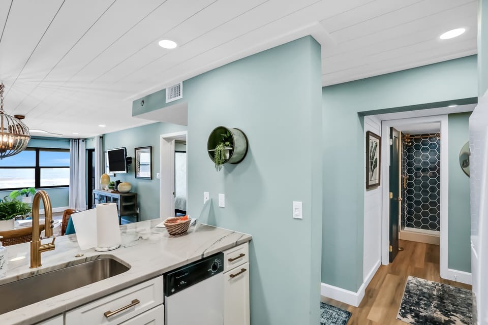 Enjoy an open-concept coastal layout connecting the kitchen and living area with ocean views. Designed for a relaxing beach stay, this bright space offers modern comfort and easy flow for gathering after days on the sand.