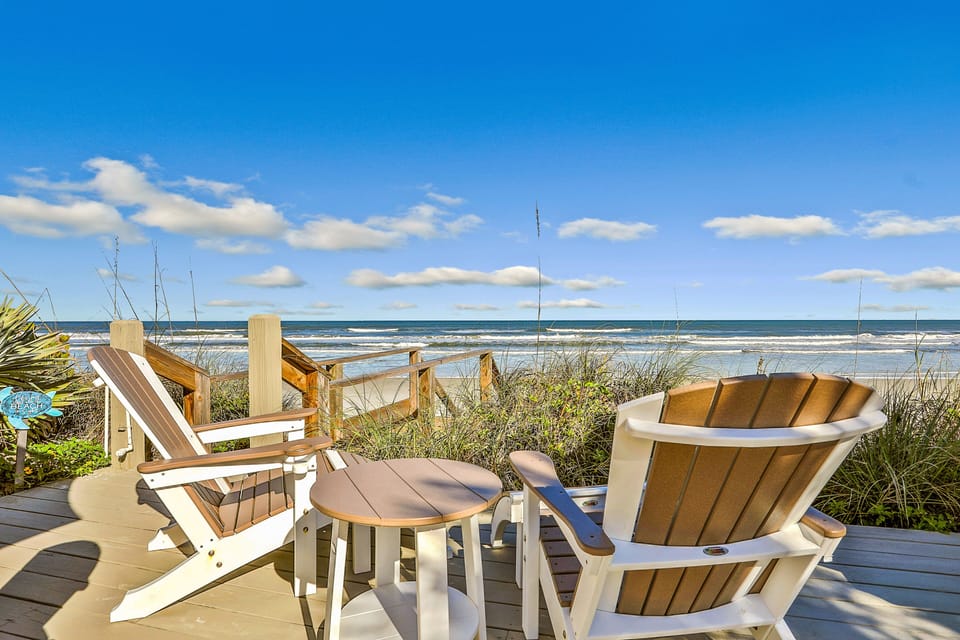 Unwind in oceanfront chairs overlooking rolling waves and blue skies. This serene beach stay features direct access to the shore, coastal breezes, and the ideal spot to relax, recharge, and enjoy your seaside getaway.