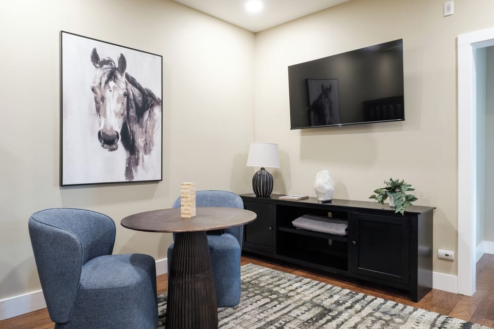 The bunk space includes a TV and comfortable seating, making it the ideal hangout spot for movie nights or games.