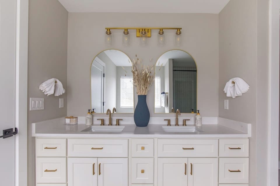 Spa inspired double vanity with elegant brass details