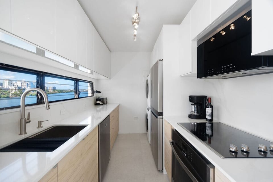 Preparing meals is a joy in this sleek, modern kitchen overlooking the water.