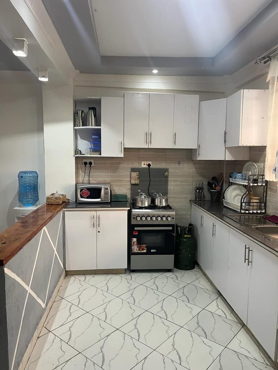 Deluxe Apartment, Garden View | Private kitchen | Fridge, microwave, cookware/dishes/utensils