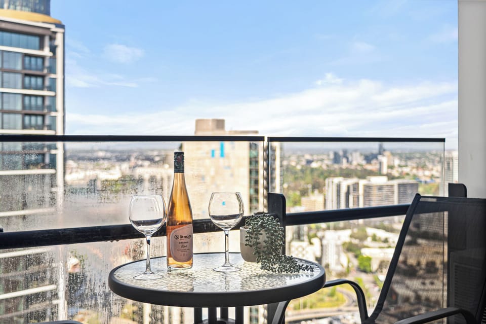 Private Balcony: Skyline views, outdoor seating, fresh air retreat above city bu