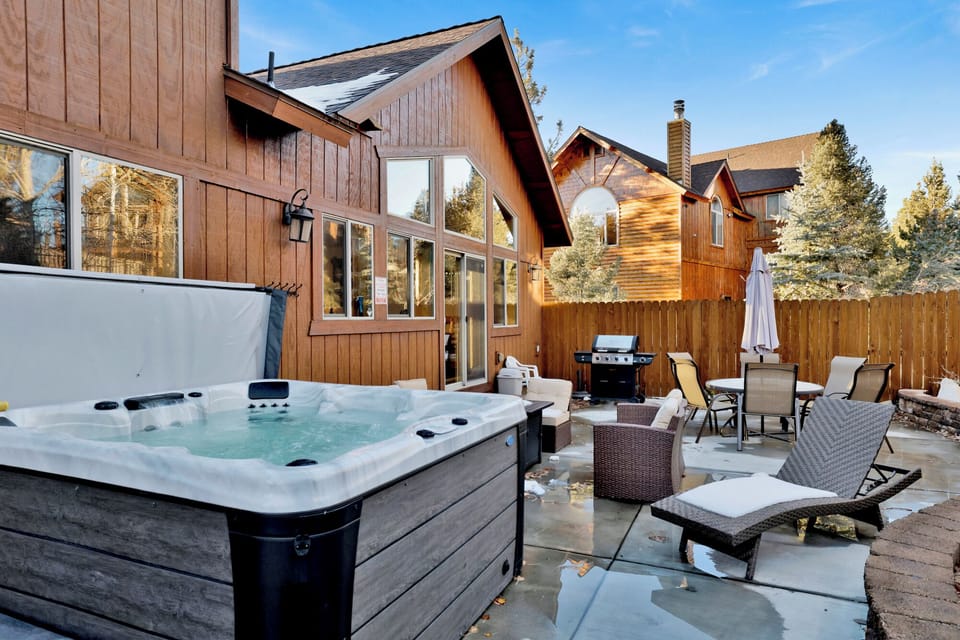 Enjoy soaking in the hot tub under the stars while the BBQ heats up and the fire pit crackles nearby.