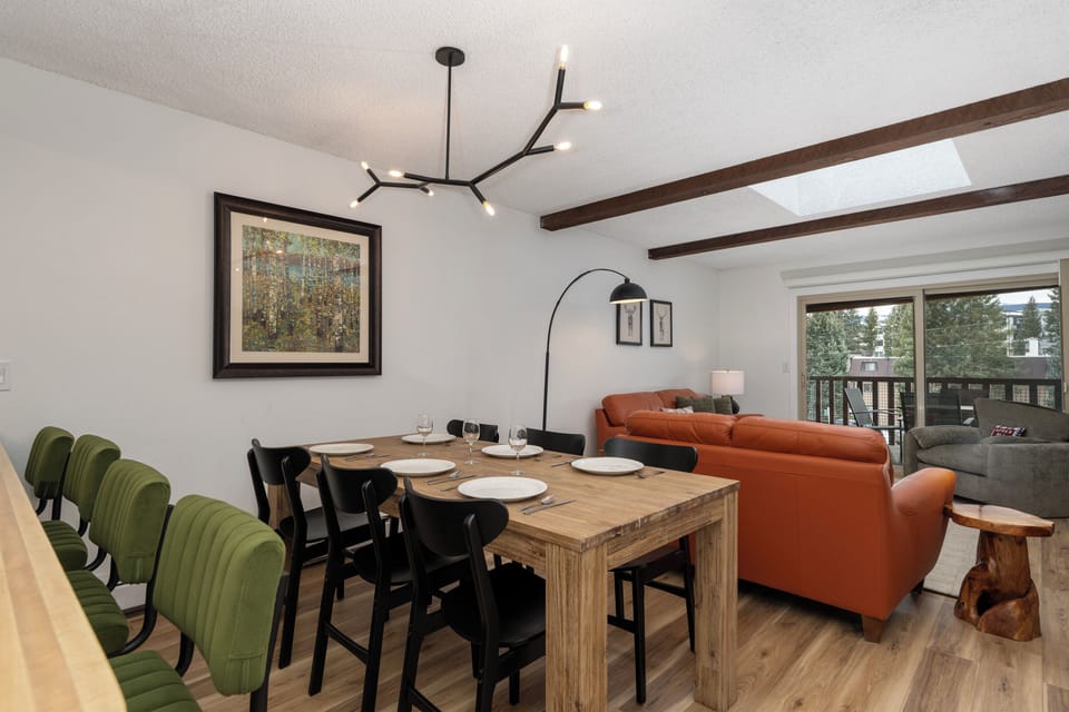 Gather around your rustic dining table for memorable meals while relaxing in the open living space with cozy leather seating.