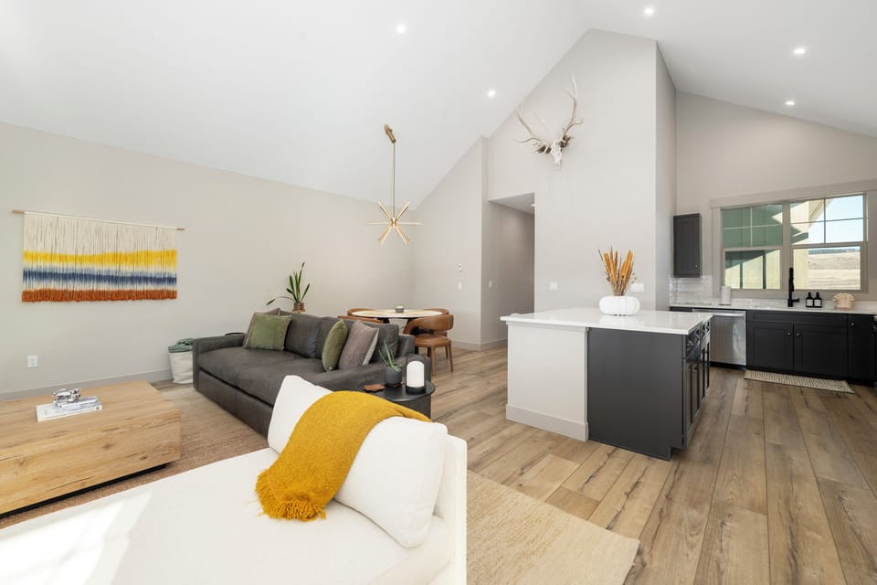 Step into your bright open-plan sanctuary where modern comfort meets warm style. Relax on the plush sofa while dinner cooks in your sleek kitchen.