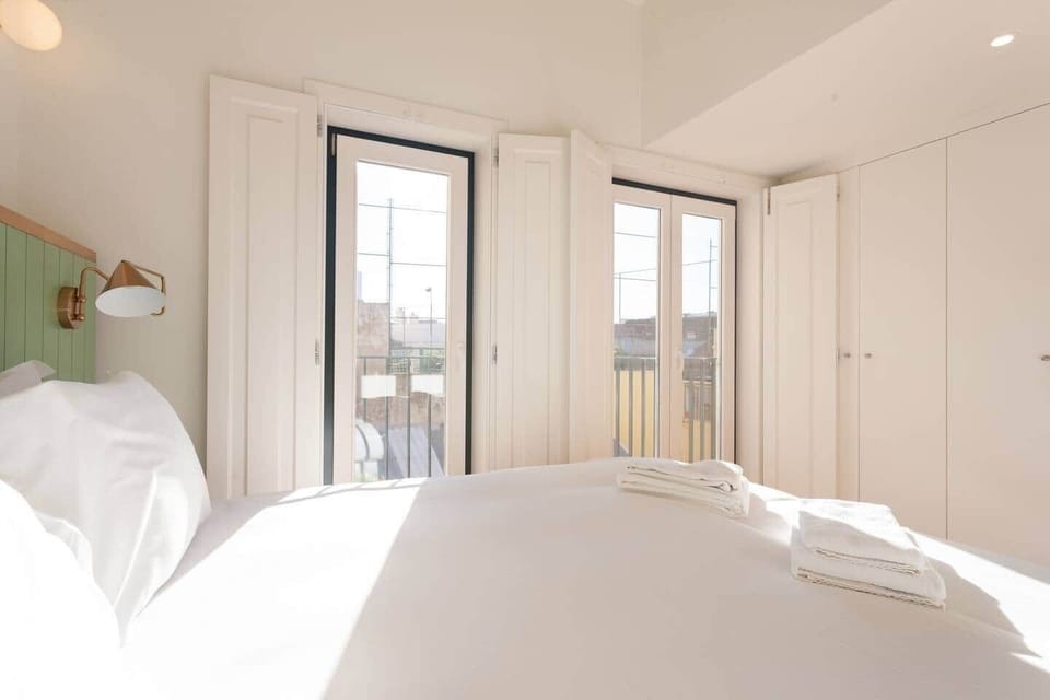 Large integrated wardrobe with plenty of space to fit both clothes and luggage.
Lots if light flowing in from two large floor to ceiling windows - both the double door and single door window open