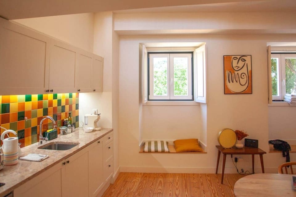 A mixture of handmade, vintage and designer furniture decorates the living space.