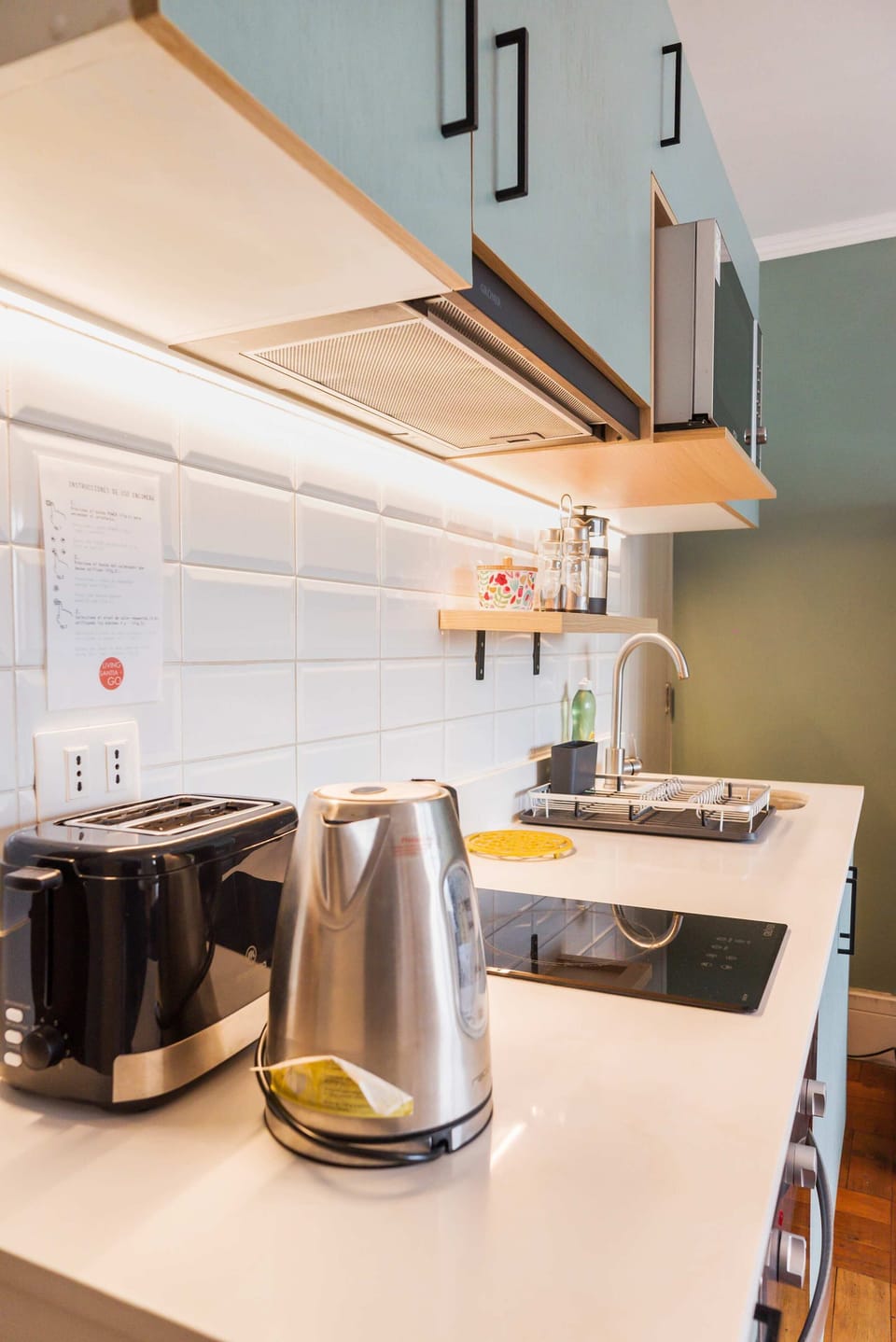 Modern kitchen with sleek appliances and stylish cabinetry, perfect for preparing meals in comfort.