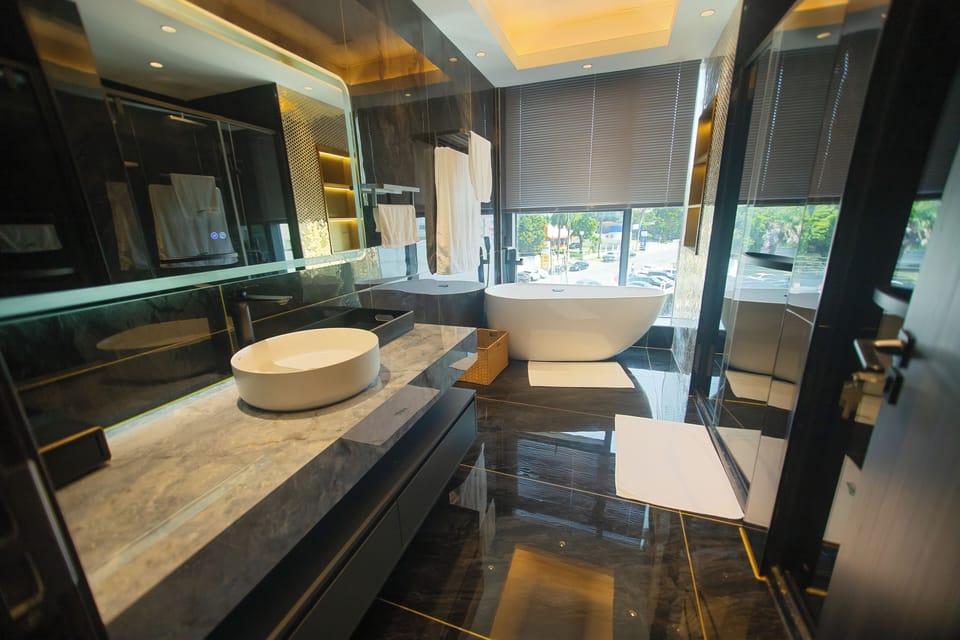 Standard Suite, Balcony, City View | Bathroom | Combined shower/tub, free toiletries, hair dryer, slippers