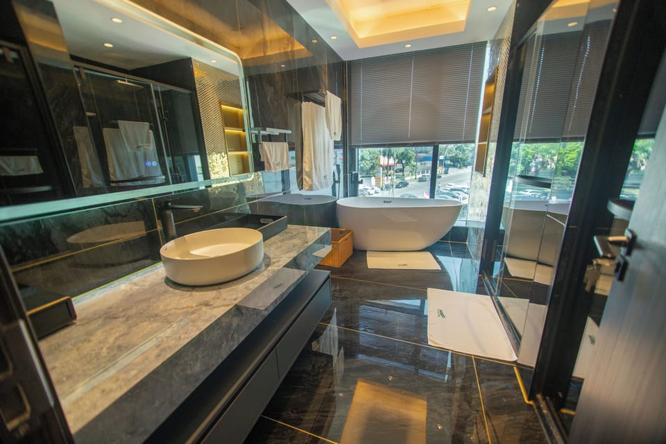 Combined shower/tub, free toiletries, hair dryer, slippers
