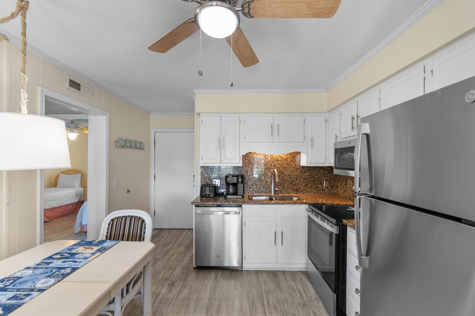 Your fully equipped kitchen features modern appliances and granite countertops, perfect for preparing meals during your stay.