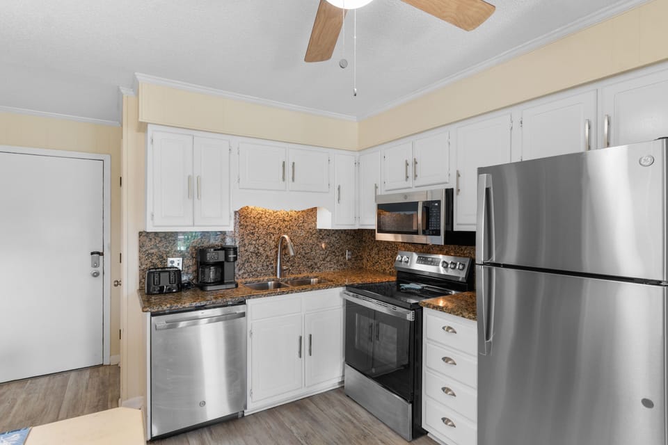 Your fully equipped kitchen features stainless steel appliances and granite countertops, perfect for preparing delicious meals during your stay.