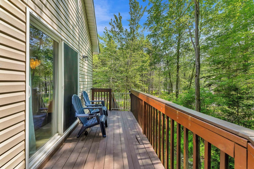 Step out onto the upper deck and enjoy peaceful views of the surrounding trees—perfect for sipping your morning coffee or unwinding with a good book in the fresh mountain air.