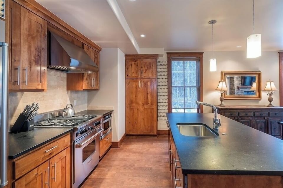 Kitchen - Fully equipped with a stainless steel gas range, microwave, dishwasher and refrigerator