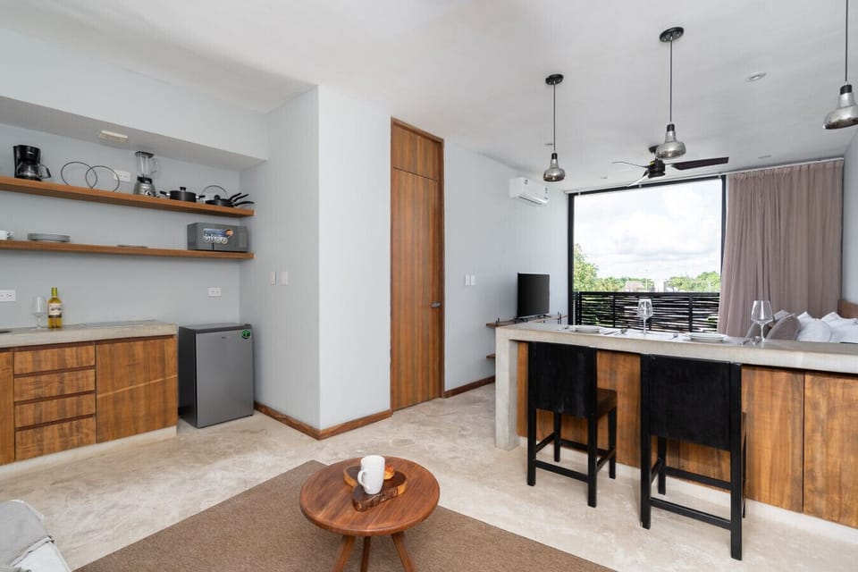 Bright kitchen and dining area with chic décor and a cozy, inviting vibe.