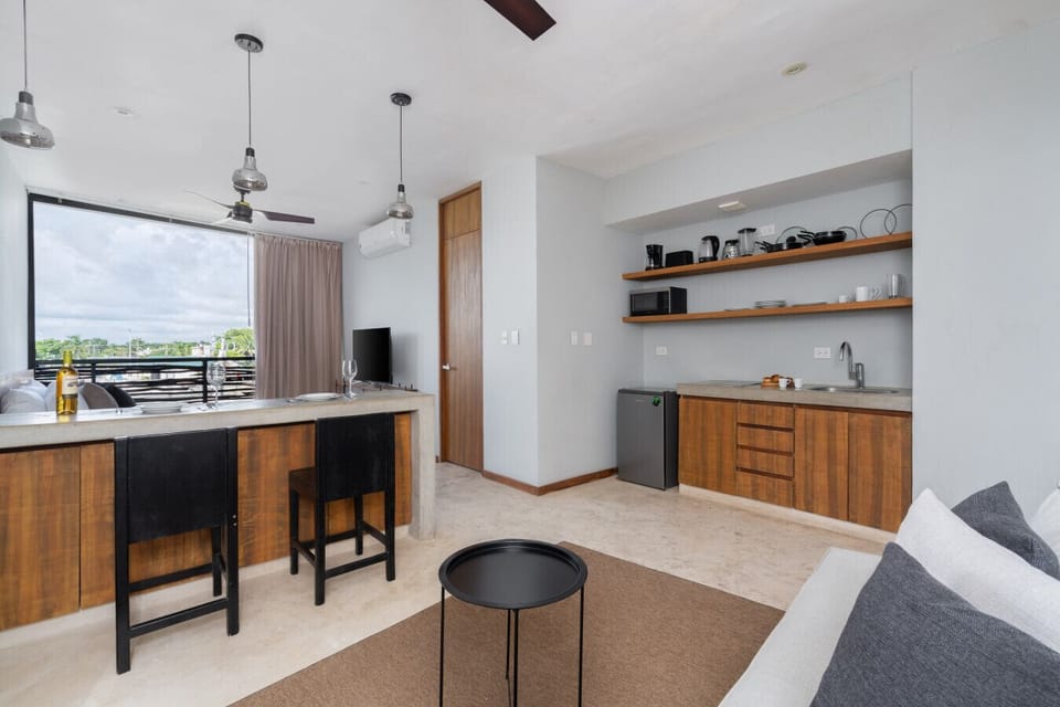 Bright kitchen with dining area, modern essentials, and welcoming vibe.