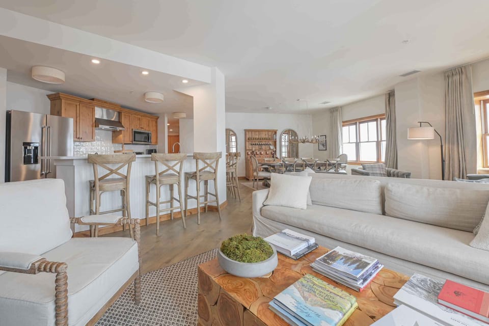 Modern kitchen with wooden cabinetry and a stylish breakfast bar, seamlessly connecting to the open living space.