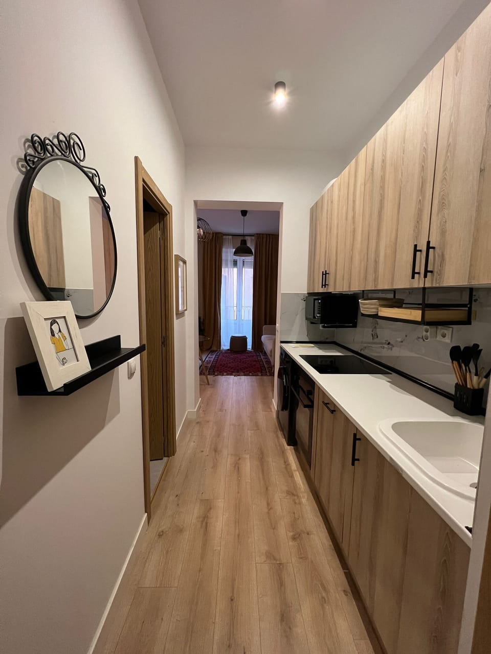 A warm hallway with wooden flooring