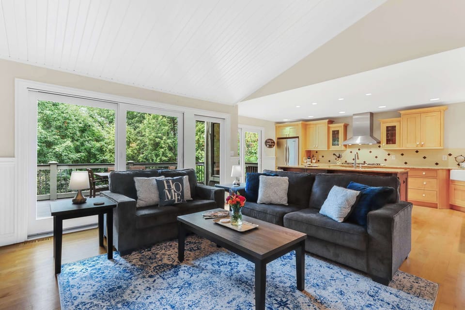 Bright living area with Smart TV and deck access 