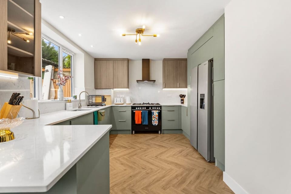 Kitchen set up with oven, microwave, fridge-freezer