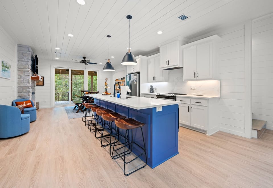 Open-concept kitchen and living area with modern finishes.