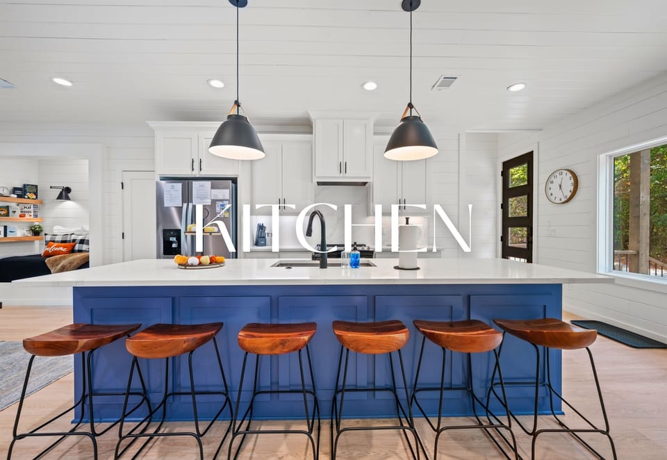 Spacious kitchen with large island and seating for five.