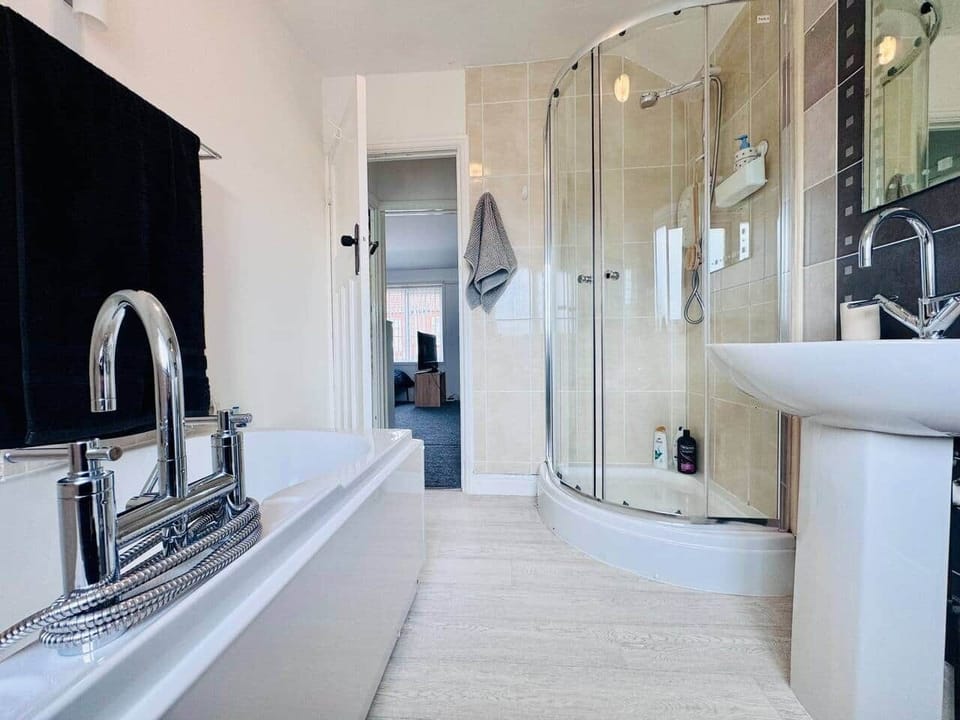 Bathroom with walk in shower and separate shower