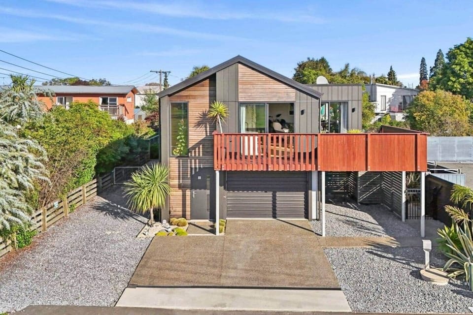 The front of the dwelling. A large sunny deck overlooking a paddock.