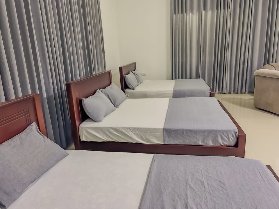 Family Triple Room, Garden View | Desk, laptop workspace, iron/ironing board