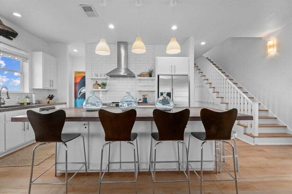 Open kitchen with bar seating and modern finishes – perfect for entertaining guests