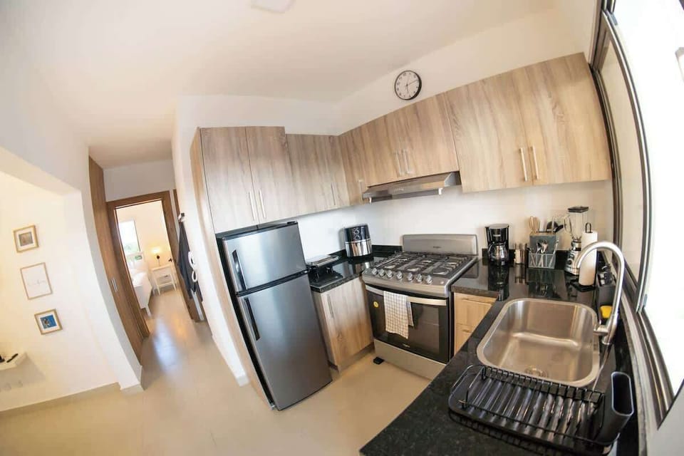 - Fully equipped kitchen with sink stove fridge and counter space
- Easy layout for cooking dining and daily routines
- Bright modern design for comfortable self catering stays

