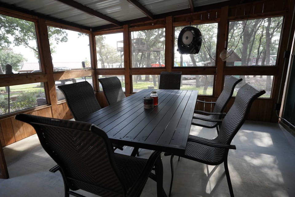 Lake House: Enjoy breakfast or hang out in our screened porch. 